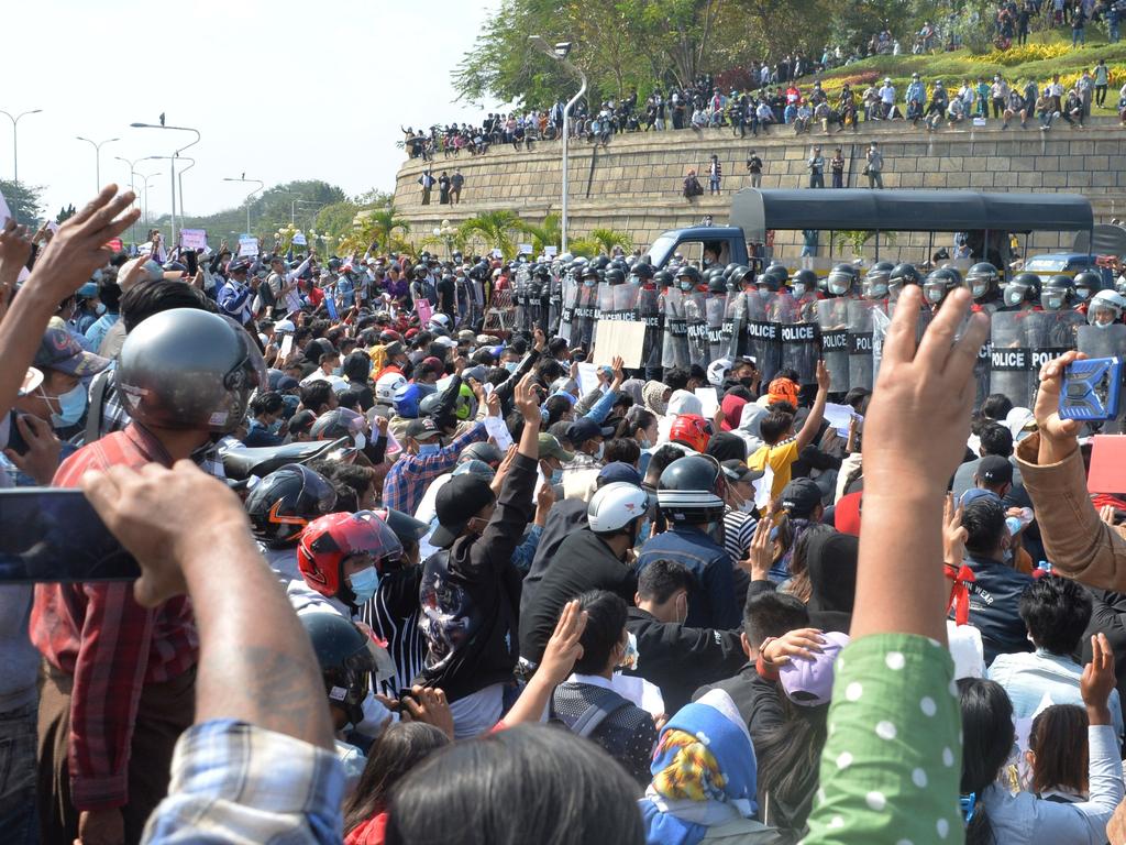 Police were accused of using brutal tactics on protesters in Nay Pyi Taw calling for leader Aung San Suu Kyi to be released. Picture: STR / AFP