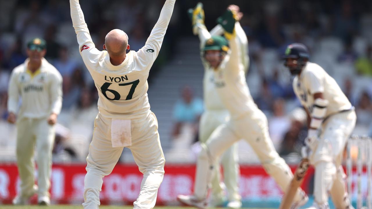 Nathan Lyon of Australia takes the final wicket. Photo by Ryan Pierse/Getty Images