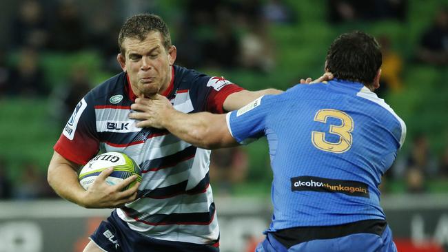 Toby Smith palms off Guy Millar at AAMI Park.