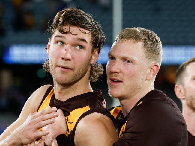 MELBOURNE, AUSTRALIA - APRIL 21: Jack Scrimshaw of the Hawks and James Sicily of the Hawks celebrate during the 2024 AFL Round 06 match between the North Melbourne Kangaroos and the Hawthorn Hawks at Marvel Stadium on April 21, 2024 in Melbourne, Australia. (Photo by Dylan Burns/AFL Photos via Getty Images)