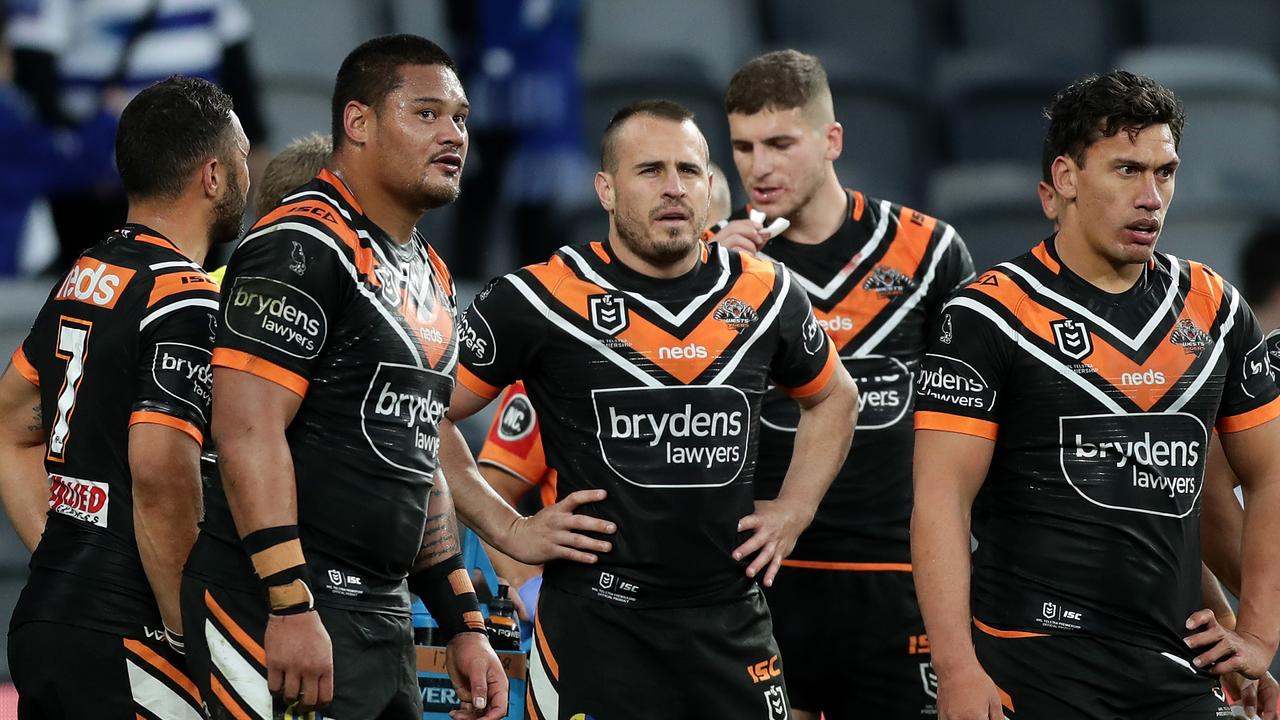 Josh Reynolds of the Tigers looks on after a Bulldogs try