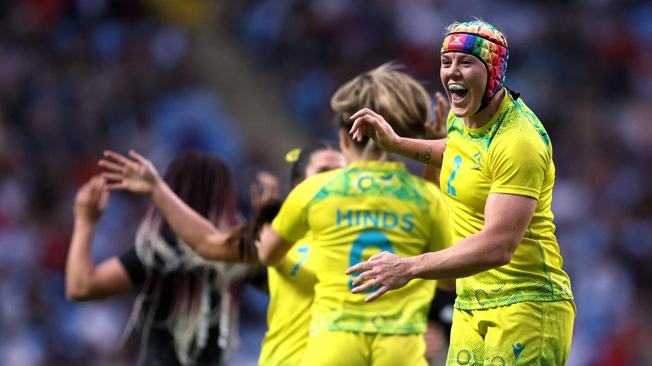 Australia's Charlotte Caslick runs away to score during their Women's Rugby  Sevens preliminary match against Fiji at Deodoro Stadium on day one, of the  Rio 2016 Olympic Games in Rio de Janeiro