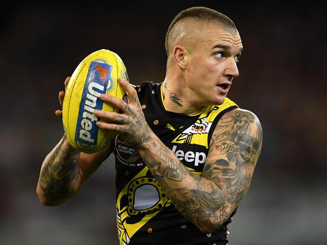 MELBOURNE, AUSTRALIA - MAY 25: Dustin Martin of the Tigers marks during the round 10 AFL match between the Richmond Tigers and the Essendon Bombers at Melbourne Cricket Ground on May 25, 2019 in Melbourne, Australia. (Photo by Quinn Rooney/Getty Images)