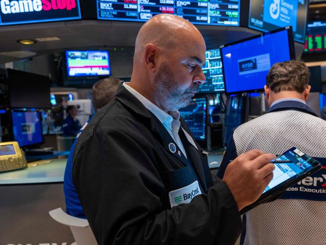 NEW YORK, NEW YORK - OCTOBER 16: Traders and others work on the New York Stock Exchange (NYSE) floor on October 16, 2024 in New York City. Stocks made modest gains in morning trading following Tuesday's loses.   Spencer Platt/Getty Images/AFP (Photo by SPENCER PLATT / GETTY IMAGES NORTH AMERICA / Getty Images via AFP)