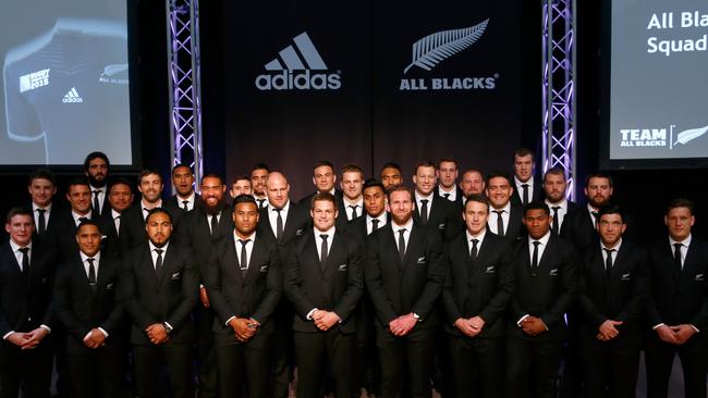 The All Blacks 2015 Rugby World Cup team pose on stage at Parliament.