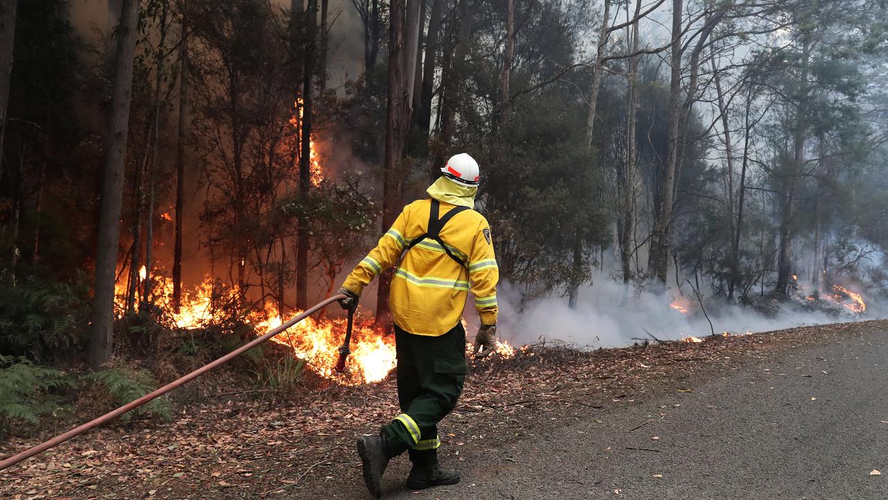 Firefighters from Sustainable Timber, Department of Parks and Wildlife and New Zealand work on a spotfire on Arve Road just out of Geeveston. Bushfires (Bush Fires) January 2019 Tasmania. Huon Valley. Picture: NIKKI DAVIS-JONES