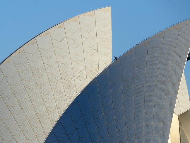 SYDNEY, AUSTRALIA - NewsWire Photos JULY 23.  A man is scene working on the sails of Sydney Opera House this morning, Sydney, Thursday, July 23, 2020.Picture: NCA NewsWire / Jeremy Piper