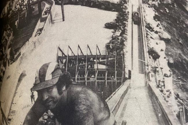 An unnamed worker putting the finishing touches on the log ride at Dreamworld in 1981. Picture: Gold Coast Bulletin archives.