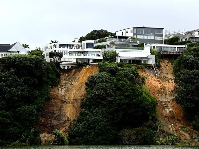 Houses are seen above landslips in Auckland, New Zealand after the city was hit with a historic amount of torrential rainfall, causing severe flooding which inundated roads and property. Picture: Getty Images