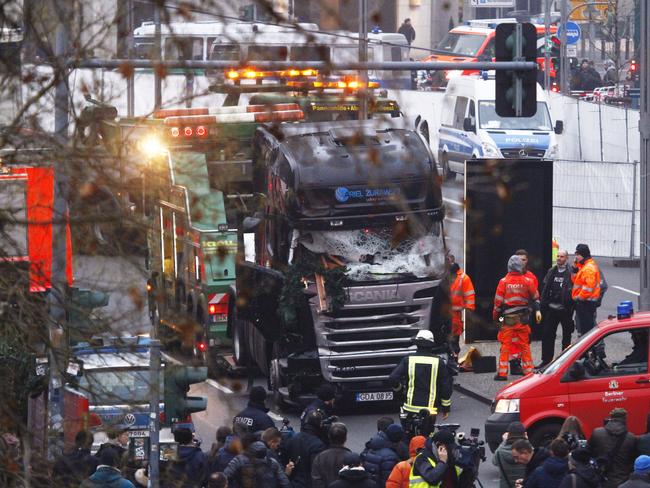 Security and rescue workers tend to the area after a lorry truck ploughed through a Christmas market. Picture: Michele Tantussi/Getty Images