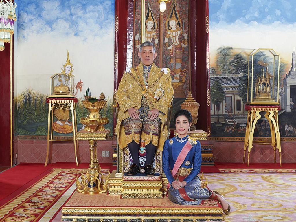 King Maha Vajiralongkorn sits on the thrown with his official consort Sineenat Wongvajirabhakdi at the royal palace in happier times. Picture: Thailand Royal Office via AP