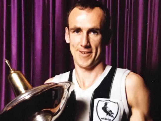 Brunswick great Barry Nolan with the VFA premiership trophy.