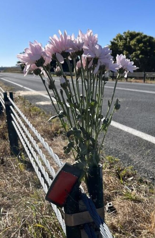 Flowers were left at the scene of the fatal crash for the 33-year-old Narooma man who died. Picture: Tom McGann.