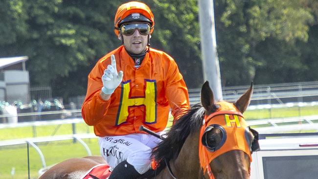 Townsville jockey Aidan Holt returns to scale on North Queensland Cups champion The Harrovian to a monumental victory at Cairns' Cannon Park despite carrying a whopping 67kg. Picture: Mike Mills.