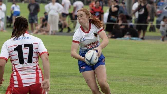 Young rugby player Annie Craig in action.