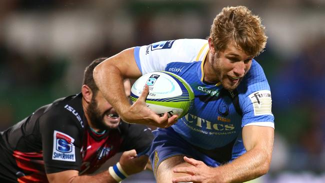 Kyle Godwin of the Force looks to break a tackle at nib Stadium in Perth.