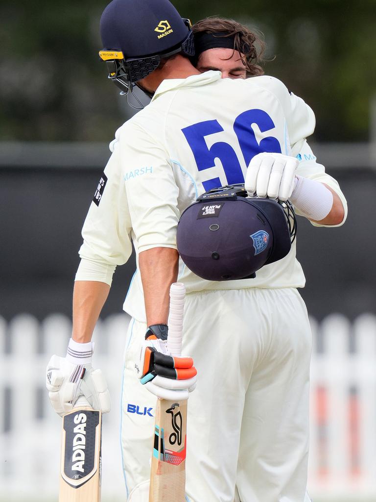 Sean Abbott is congratulated by Mitchell Starc after reaching his century.