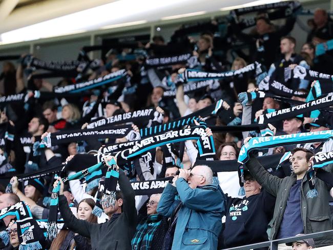 AFL - Saturday, 12th September, 2020 - Port Adelaide v Essendon at the Adelaide Oval. Port Fans stand for "Never Tear Us Apart" Picture: Sarah Reed