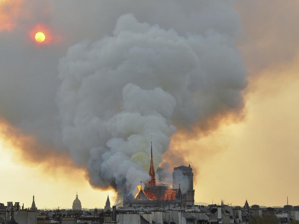 Flames and smoke rise from the blaze at Notre Dame cathedral in Paris, Monday, April 15, 2019. Picture: Thierry Mallet