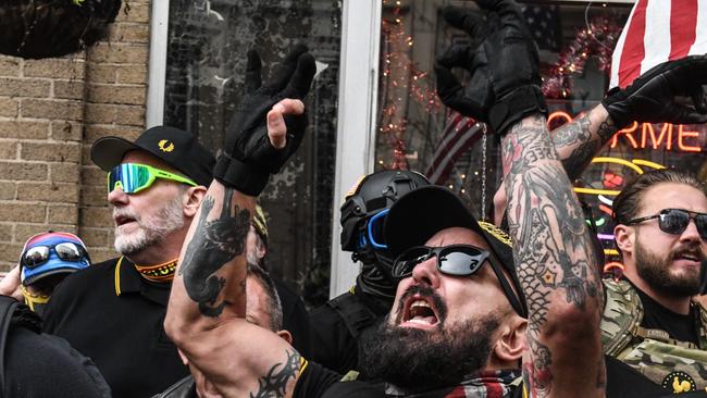 Members of the Proud Boys gather outside of Harry's Bar during a protest in Washington, DC. Picture: AFP