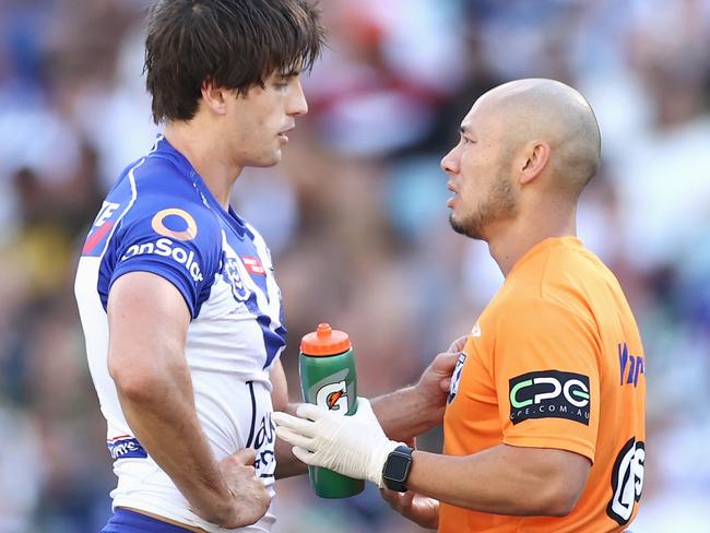 SYDNEY, AUSTRALIA - APRIL 02: Lachlan Lewis of the Bulldogs receives attention during the round four NRL match between the Canterbury Bulldogs and the South Sydney Rabbitohs at Stadium Australia, on April 02, 2021, in Sydney, Australia. (Photo by Cameron Spencer/Getty Images)