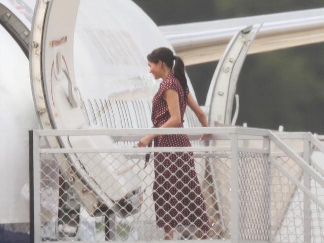 Meghan Markle pictured boarding a plane at Sydney Airport this morning to fly to Hervey Bay Airport. Picture: David Swift