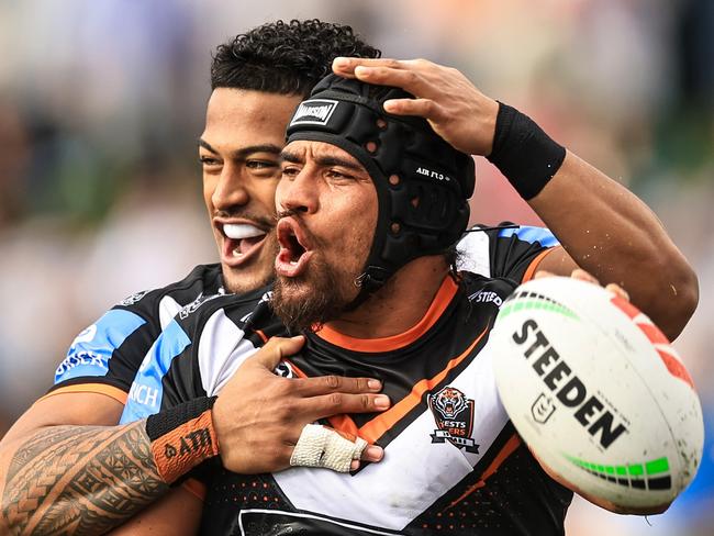 TAMWORTH, AUSTRALIA - MAY 11: Isaiah Papali'i of the Tigers celebrates a try with team mates during the round 10 NRL match between Wests Tigers and Newcastle Knights at Scully Park, on May 11, 2024, in Tamworth, Australia. (Photo by Mark Evans/Getty Images)