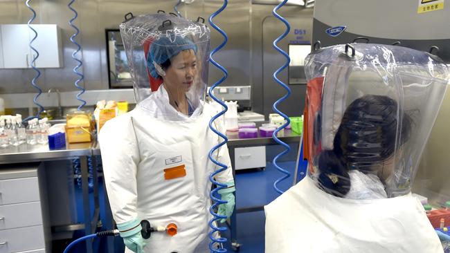 EMBARGO FOR TWAM 20 MARCH 2021 FEE APPLIESWUHAN, CHINA - FEBRUARY 23 2017: Virologist Shi Zheng-li, left, works with her colleague in the P4 lab of Wuhan Institute of Virology (WIV) in Wuhan in central China's Hubei province Thursday, Feb. 23, 2017.- PHOTOGRAPH BY Feature China / Barcroft Studios / Future Publishing (Photo credit should read Feature China/Barcroft Media via Getty Images)