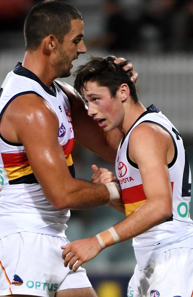 Jones is congratulated by captain Taylor Walker after kicking a goal against GWS in the JLT Series game on Friday night. Picture: Tracey Nearmy (Getty).