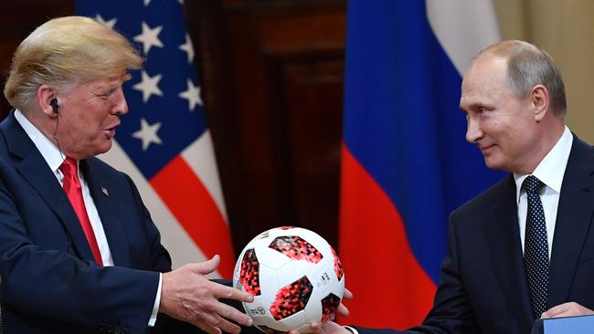 During the joint press conference in Helsinki, Russia's President Vladimir Putin offered a ball of the 2018 football World Cup to US President Donald Trump. (Pic: Yuri Kadobnov/AFP)