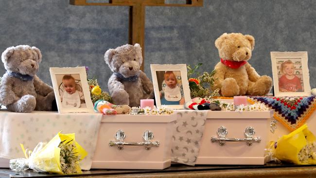 The coffins of (L-R) Beatrix, Alice and Charlotte were displayed during their funeral, held at the same time as the funerals of their grandmother Beverley Quinn and mother Mara Harvey. All were murdered in their home last month. Picture: AAP/Richard Wainwright