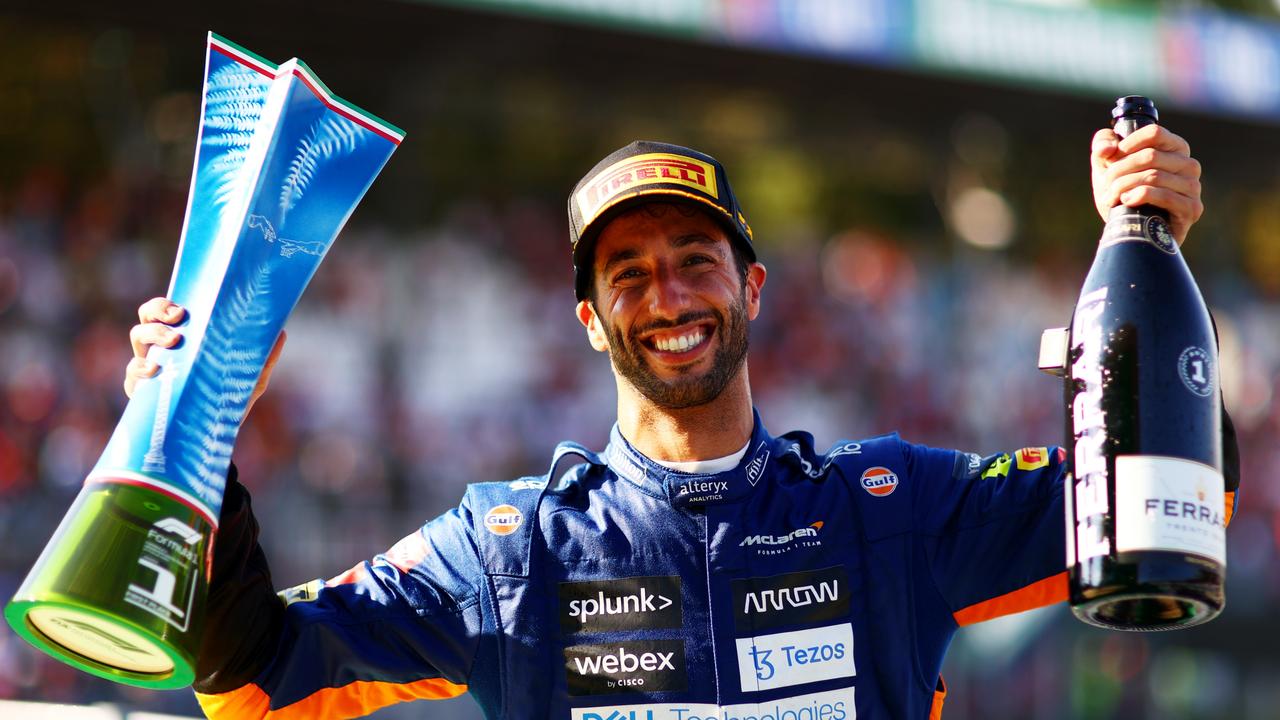 MONZA, ITALY – SEPTEMBER 12: Daniel Ricciardo of Australia and McLaren celebrates on the podium after winning the F1 Grand Prix of Italy at Autodromo di Monza on September 12, 2021 in Monza, Italy. (Photo by Dan Istitene – Formula 1/Formula 1 via Getty Images)