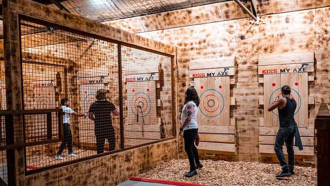 A Kiss My Axe 'urban indoor axe throwing' centre will allow you to “sling some steel” from November 26. Picture: Supplied