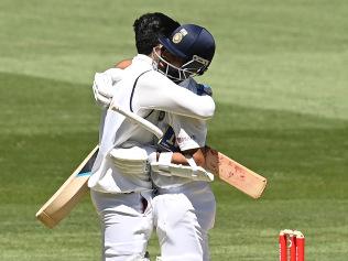 Shubman Gill and Ajinkya Rahane embrace after India's win.