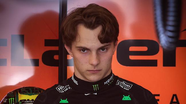 2025 Melbourne Grand Prix. Friday. F1 Practice 2 Pit Lane. McLaren driver Oscar Piastri psych himself up before putting on his helmet.                                                            Picture: David Caird