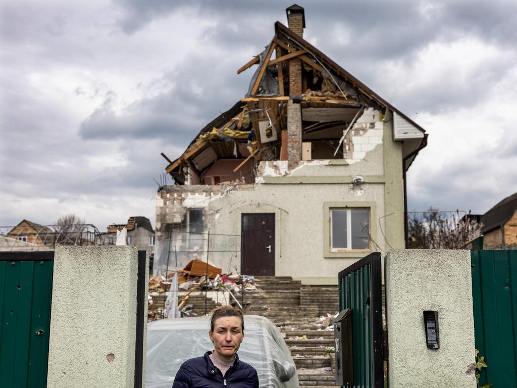 Local resident Oksana leaves the remnants of her home after searching for salvageable items in Gostomel, Ukraine. Picture: Getty Images