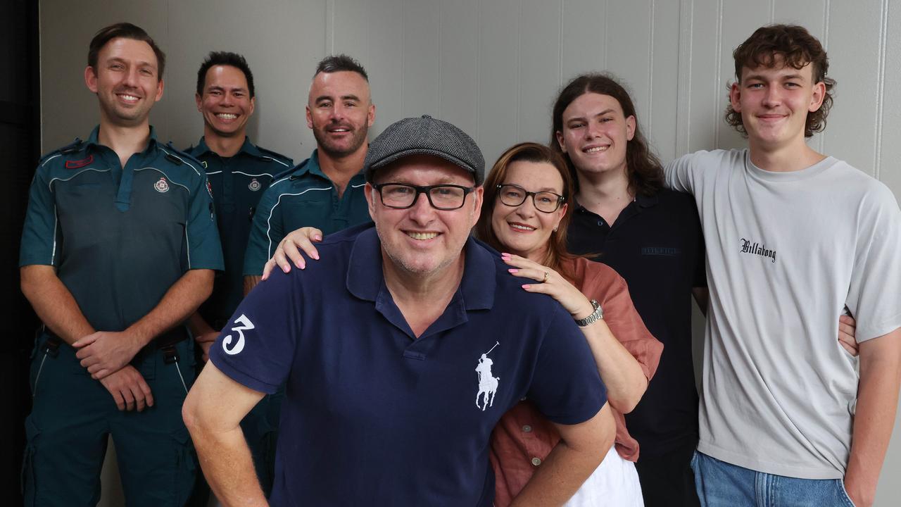 Steve Preston with his wife Bronwyn and sons Jacob, 21 and Ben, 17, meet with paramedics Alex Ewart, Jason Keen, and Ross Nihill, who saved his life, Eagleby. Picture: Liam Kidston