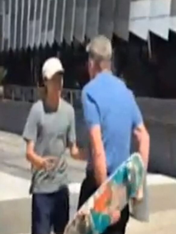 Sam Newman during an altercation with a skater outside his Docklands apartment.