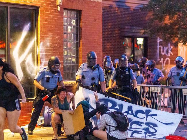 Police spray protesters with pepper spray during a demonstration in Minneapolis. Picture: AFP