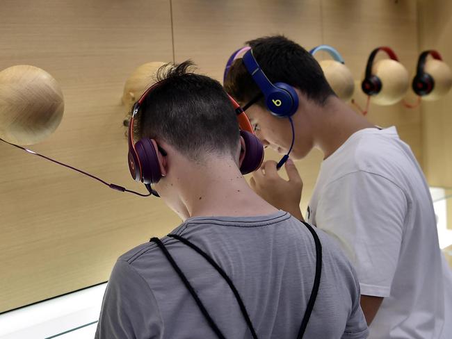 People attend the opening of the newest Apple Store in Milan. Picture: MEGA