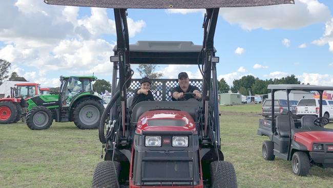 MEN ON A MISSION: Cooper Massey, 10, directs dad Simon on where to drive the Toro Outcross, machine which will set back those looking after golf course or stadium surfaces around $140,000. Photo: Alison Paterson