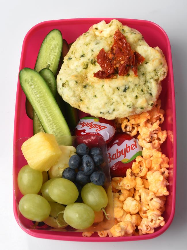 Zucchini, corn and bacon muffins, grapes, pineapple and blueberries, Babybell cheese, cucumber sticks and plain popcorn.