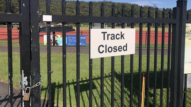 The synthetic athletics track at the NSW Government's Sydney Academy of Sport on Wakehurst Parkway, Narrabeen, was padlocked on Thursday as sport authorities try to work out what has made the track “unsafe” for runners. Picture: Jim O’Rourke.