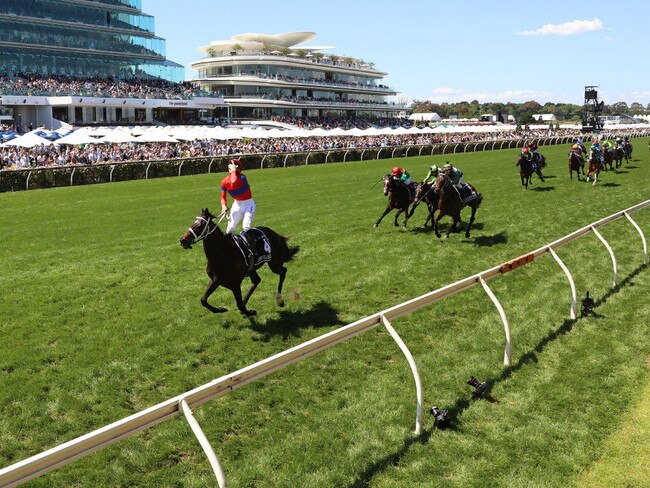 James Mcdonald riding #4 Verry Elleegant celebrates winning race 7, the Lexus Melbourne Cup.