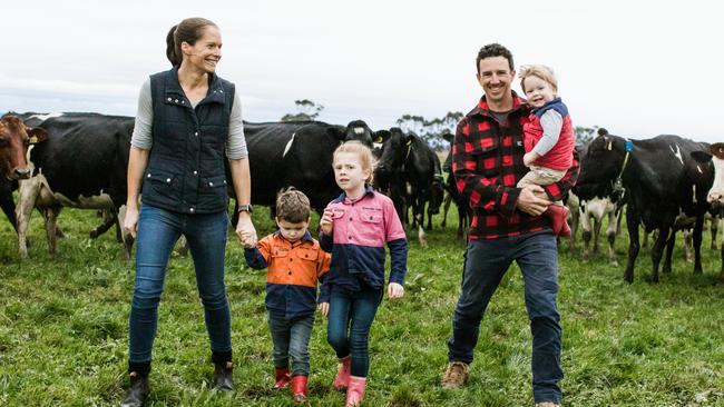 Brad and Jenna White with their children William, 4, Maddison, 6, and Lachlan, 2, with their herd near Maffra.