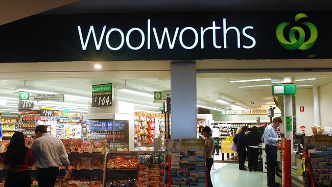 The Woolworths Ltd. company logo is displayed on one of its supermarkets in Sydney, Australia, on Monday, Aug. 25, 2008. Woolworths Ltd., Australia's biggest retailer, increased second-half profit 23 percent after adding more profitable groceries and cutting prices to win market share from second-ranked Wesfarmers Ltd. Photographer: Jeremy Piper/Bloomberg News