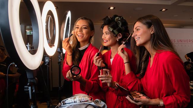 Priya Serrao, centre, getting ready tonight with Miss Universe hopefuls from left Eleanor Baillieu, 25, Priya Serrao, 27 and Marijana Radmanovic, 27 at the Sofitel Melbourne. Picture: Jason Edwards