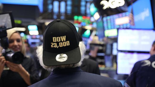 A trader wears a hat reading Dow 23,000 on the floor of the New York Stock Exchange (NYSE) on October 17, 2017 in New York City. (Spencer Platt/Getty Images/AFP)