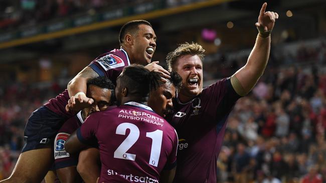 Reds players celebrate a try to Alex Mafi. Picture: AAP