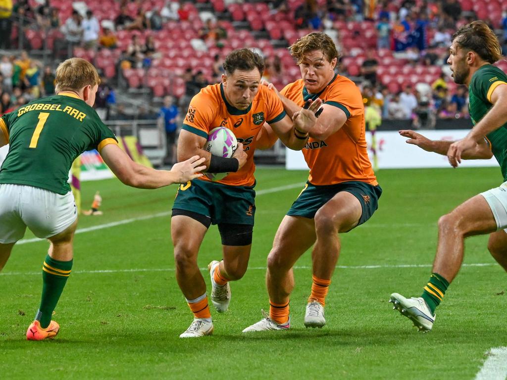 Australia’s Hayden Sargeant runs with the ball during HSBC Rugby Sevens tournament, National Stadium in Singapore on May 4, 2024. (Photo by Roslan RAHMAN / AFP)